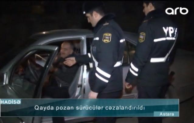 Sərxoş sürücü maşını polisin üstünə sürdü - Video